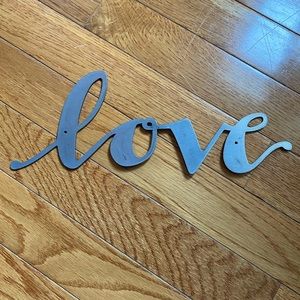 “Love” cut out metal sign
